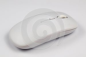 Side view of a sleek white wireless computer mouse