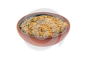 Side view of a small bowl filled with Cajun blackened seasoning isolated on a white background photo