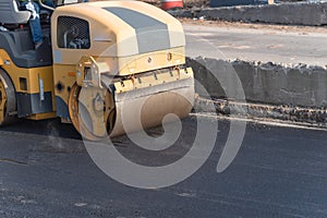 Working ride on roller asphalt compactor