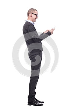 Side view of smiling business man using his tablet computer