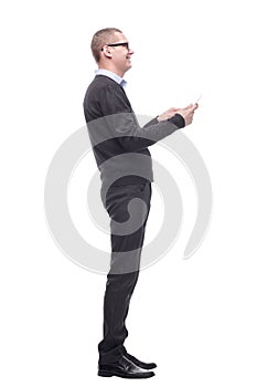 Side view of smiling business man using his tablet computer