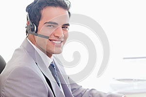 Side view of smiling businessman with headset on