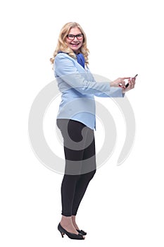 side view. smiling woman making an order in an online store .