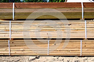 Side view of a stack of lumber, materials for building a new house