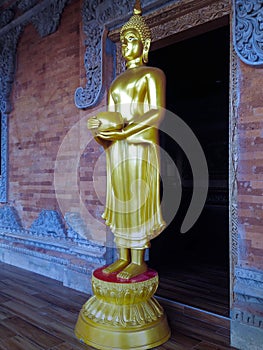 Side View Of Standing Buddha Statue Carrying