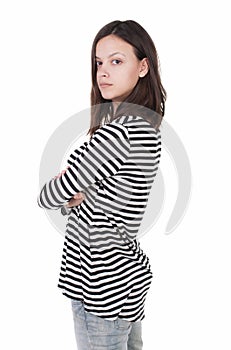 Side view of standing young beautiful brunette woman in striped