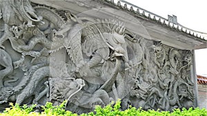 Side view stone carving of Dragon zooming