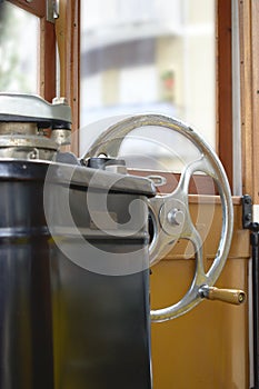 Side view of a streetcar`s steering wheel