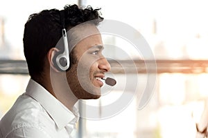 Side view stubbled black man with headset. photo