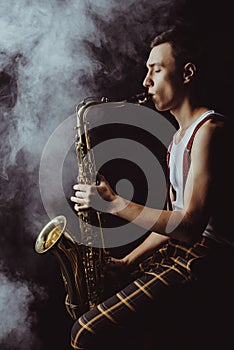 side view of stylish young jazzman