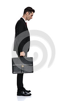 Side view of thoughtful businessman looking down