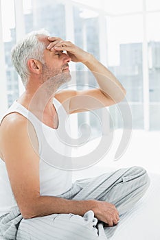 Side view of a thoughtful mature man in bed