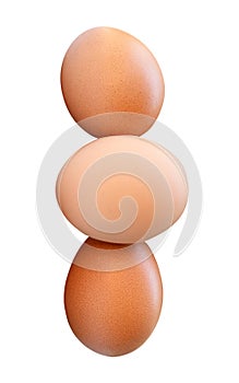 Side view of three fresh brown chicken eggs in stack isolated on white background with clipping path