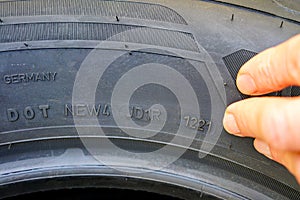Side view of tire with designation of week and year of tire production photo