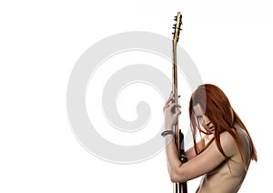 Side view of topless rock woman holding electric guitar on a white background. copyspace for your text