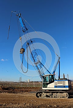 Side view of tracked mobile crane in a construction site