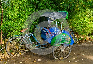 Side view of a traditional Asian cycle rickshaw, Vintage transportation vehicle from Asia