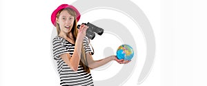 Side view of Trendy young girl in striped t-shirt and red hat holding world globe looking to camera studio shot