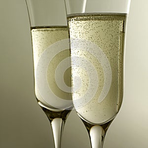 Side view of two glasses of champagne. Conceptual image