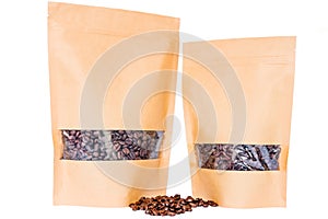 Side view of two kraft paper doypack stand up pouches with window and zipper filled with coffee beans on white background