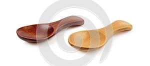 Side view of two small wooden spoons for tea or shugar isolated on white background. Dark and light empty spoons for food design.