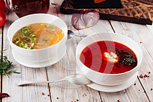 Side view on two soups borsch and vegetable