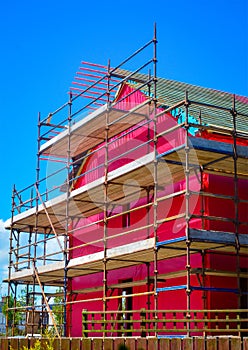 Side view of a two-storey house under construction