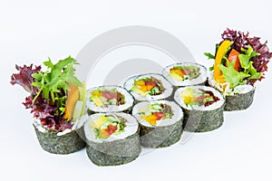 Side view of Vegetable Futomaki Sushi Roll isolated on white bakground. Maki roll with tomato, cucumber, avocado, paprika, bell pe
