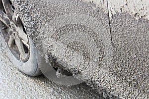 Side view of a vehicle covered in thick mud