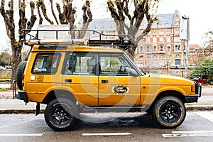 Side view of Vintage new yellow Land Rover