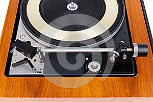 Side view of vintage turntable vinyl record player isolated on white