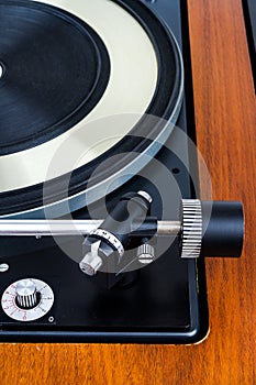 Side view of vintage turntable vinyl record player isolated on white