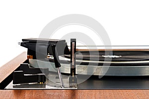 Side view of vintage turntable vinyl record player isolated on white