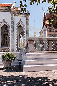 Side view of White Building with red roof against a blue sky at Grand Palace, Thailand