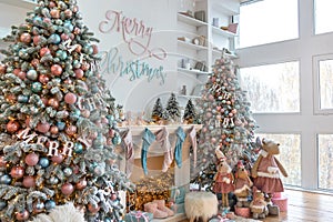 Side view of white living room with big windows and Christmas New year decor,light garland and Christmas tree with presents under