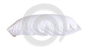 Side view of white pillow with case after guest\'s use in hotel or resort room isolated on white background