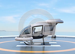 Side view of white self-driving passenger drone parking on the helipad