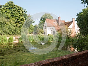 Side view of Willy Lotts& x27; cottage and river front on a clear sun