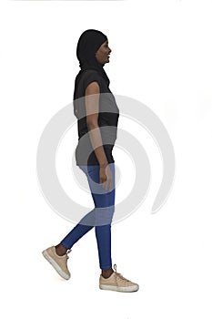 Side view of a woman with casual clothing and burka