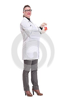 Side view of woman doctor dark hair in medical coat or scientist holding beaker with red liquid