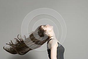 Side View Of Woman With Long Hair Blowing In Wind