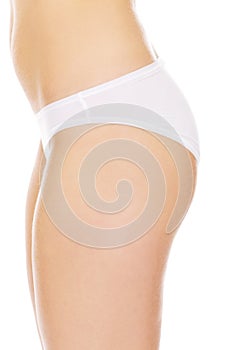 Side view of woman body in white underwear