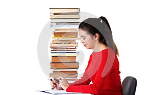 Side view woman sitting with stack of books