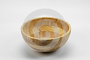 Side view of a wooden cup on a light background. Cups.