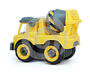 Side view of Yellow plastic concrete mixer truck toy isolated on white background.