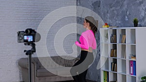 Side view of young Caucasian woman workout at home, doing fitness exercise, running on spot at home. Sport, fitness