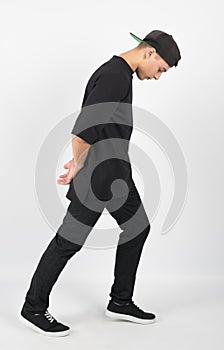 Side view of young muscular man wearing black clothes