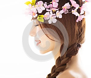 Side view of young smiling beauty face with flower