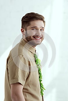 side view of young smiling man