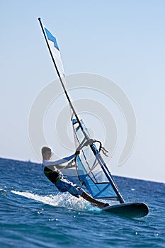 Side view of young windsurfer